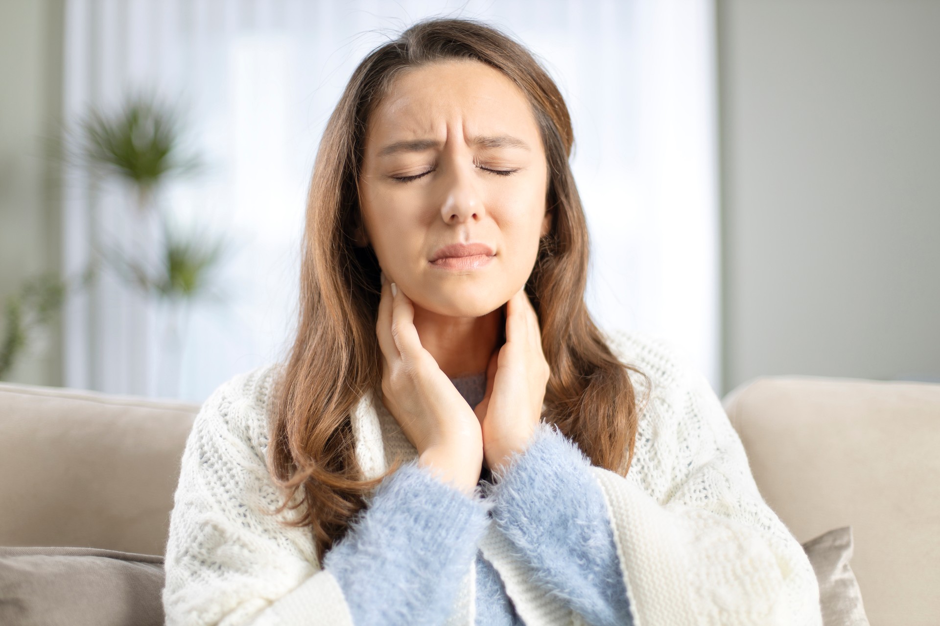 Young woman suffering from cold