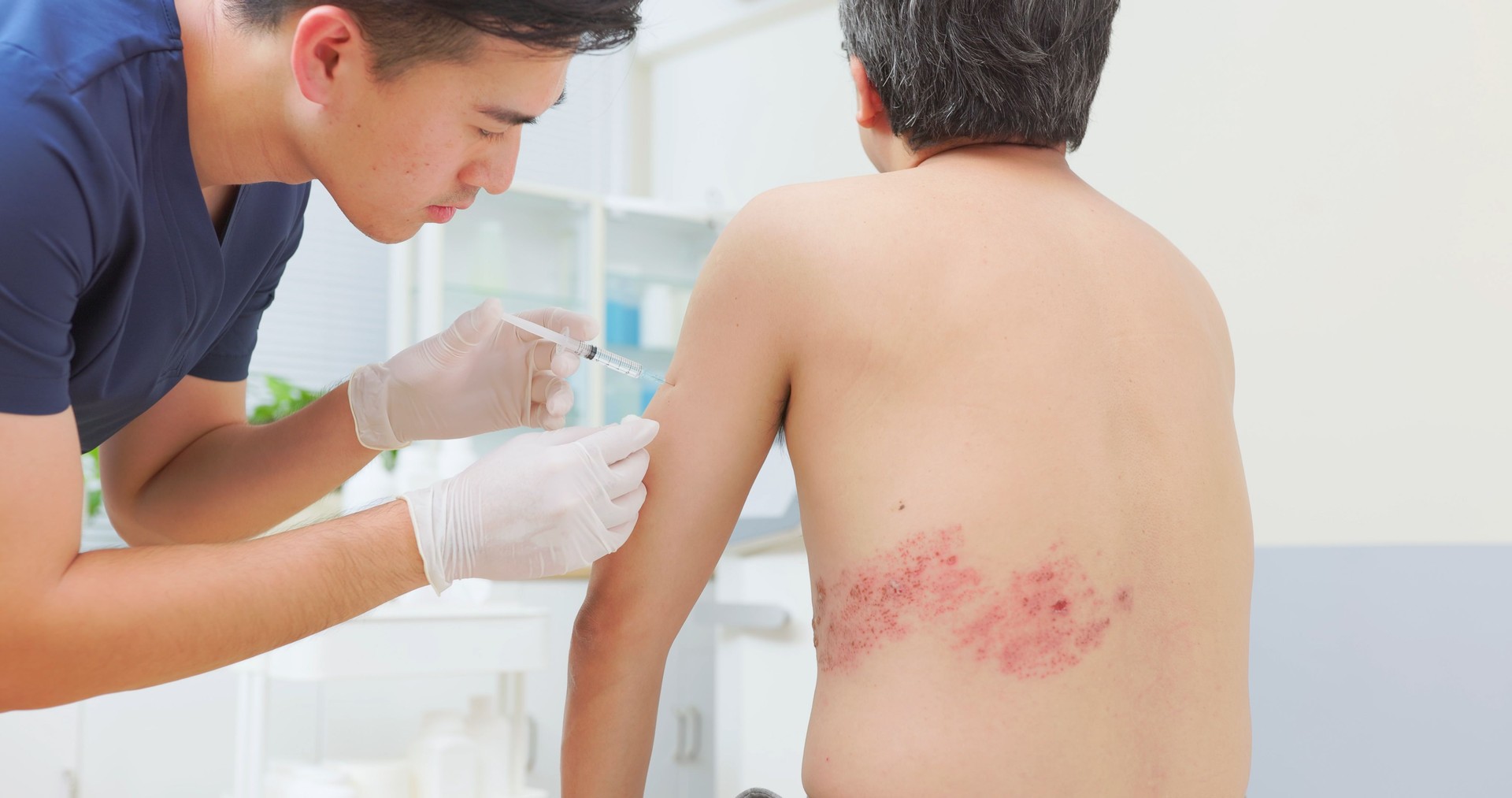 doctor give man injection