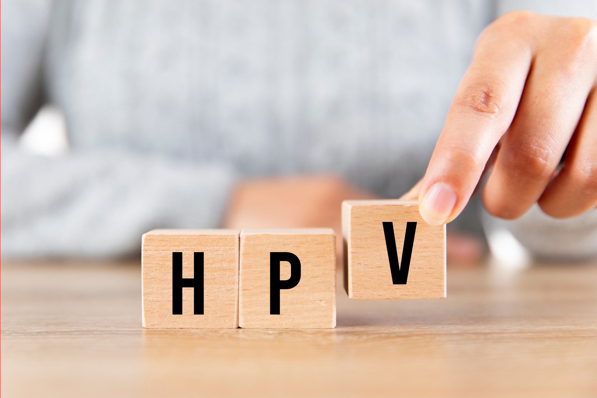 Wooden blocks spelling out the acronym 'HPV' (Human Papillomavirus), symbolizing awareness and prevention. Ideal for promoting HPV vaccination services at Chartwell Pharmacy in Southampton.